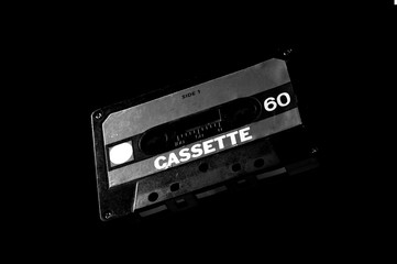 black audio cassette on dark background