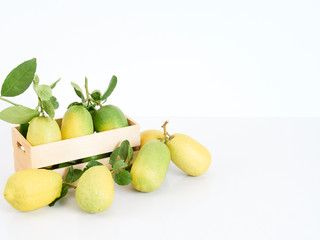 Lemon with leaves in wooden box