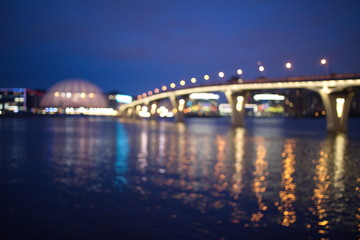 Fototapeta premium Blurry city lights on a winter evening