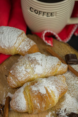 Morning croissant with coffee mug