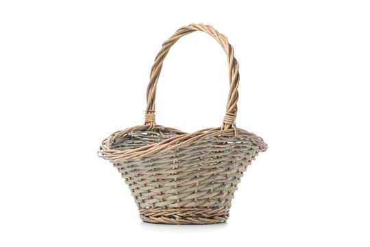 Wicker basket with handle isolated on white background