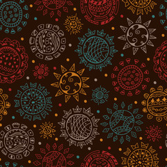 Colorful Ethnic solar symbols on dark background Seamless pattern. Ornamental Suns hand drawn doodles