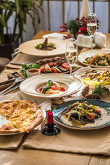 Served table with dishes. side view. light background
