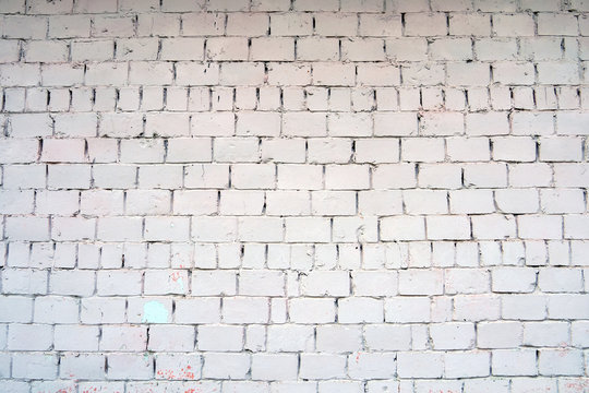 White wall of white dirty cement blocks. Empty horizontal building texture background, copy space for text