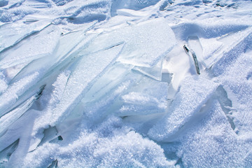 Fototapeta na wymiar Broken ice on surface of frozen lake in Russia, Baikal Lake in winter, landscape photography