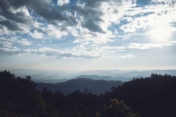 landscape mountains forests sky in the evening