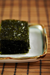 Small cut dried seaweed on plate 