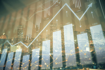 Financial graph on night city scape with tall buildings background multi exposure. Analysis concept.