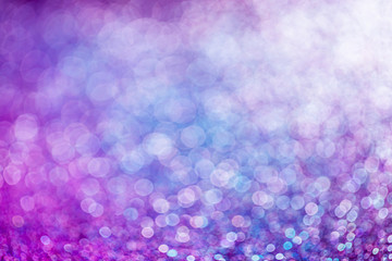 Purple glitter raster festive background. Abstract violet blurred circles. Bokeh lights with bright...
