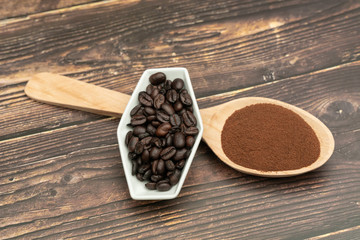 Roasted coffee beans, ground coffee, Cup of coffee, Wooden spoon with roasted coffee