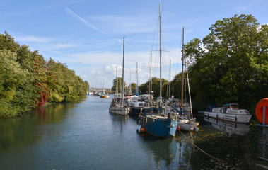 Fototapeta na wymiar Boats along the river canal 