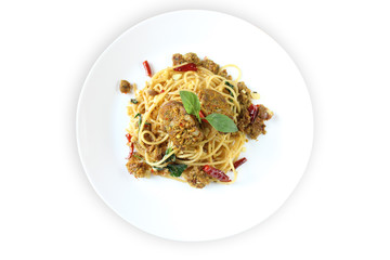 Spaghetti with Northern Thai spicy sausage isolated on white background. Spaghetti cook with garlic,dry chili and sweet basil. Thai fusion food.