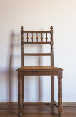 Beautiful vintage wooden chair in the home interior, vertical picture