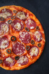 salami pizza with cheese (dough, tomato sauce and other ingredients) menu concept. food background. top view. copy space