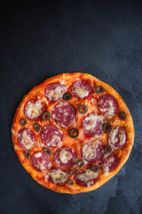 salami pizza with cheese (dough, tomato sauce and other ingredients) menu concept. food background. top view. copy space