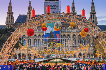 Festive cityscape - view of the Vienna Christmas World and Vienna City Hall (Wiener Rathaus) on...