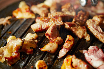 Korean BBQ, meat on iron plate 