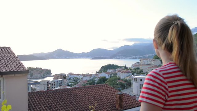 Blode young woman looking at beautiful scenery