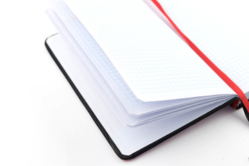 open notebook on a white background .on an office desk
