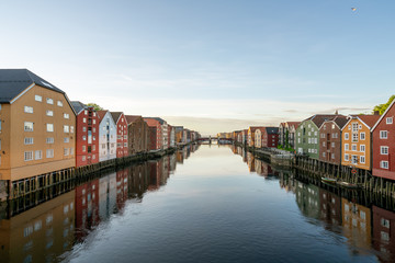 Colorful wooden buildings near Nidelva river in the city of Bakklandet/Trondheim in Norway. Architecture, buildings, travel and photography concept.