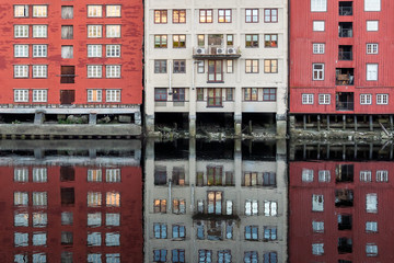 Colorful wooden buildings near Nidelva river in the city of Bakklandet/Trondheim in Norway. Architecture, buildings, travel and photography concept.