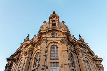 Fototapeta na wymiar A low angle show of the facade of Frauenkirche (Our Ladys church) in Dresden, Germany, just before sunset