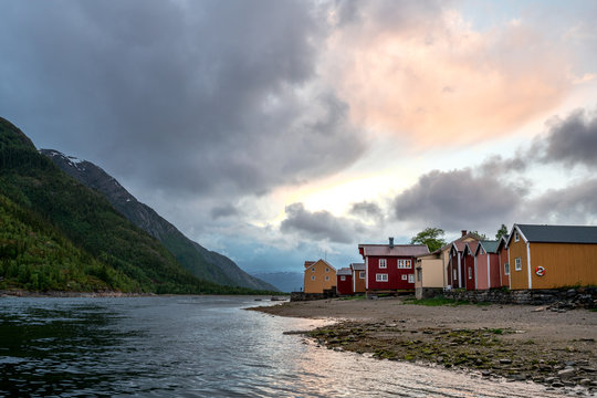 Old wooden building on the beach in the city of Mosjoen in Northern Norway during rainy weather. Architecture, landscape near me and travelocity concept.