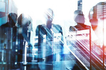 Background concept with business people silhouette at work. Double exposure and light effects