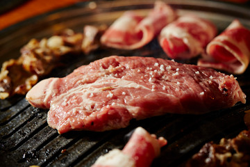 Korean BBQ, meat on iron plate 