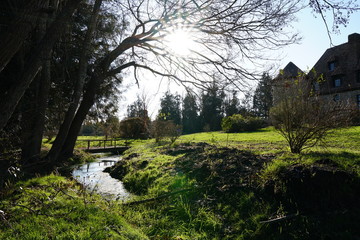 Fototapeta na wymiar french countryside sunny spring manor garden at the river