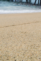 Fototapeta na wymiar toma de cerca de arena de playa