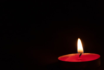 Red candles on a black background. Fire in the dark. Candle light. Light it up. Forever.