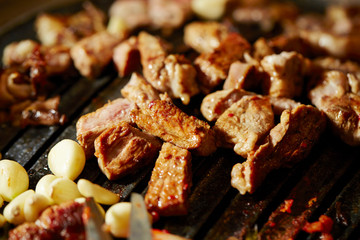 Korean BBQ, meat on iron plate 