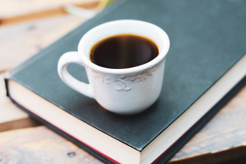 a cup of coffee and a book