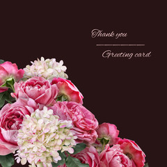 Obraz na płótnie Canvas Bouquet of garden flowers. Pink roses and white hydrangea isolated on dark background. Floral card with copy space. For invitations, greeting, wedding card.