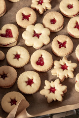 Linzer Christmas cookies filled with red currant jam
