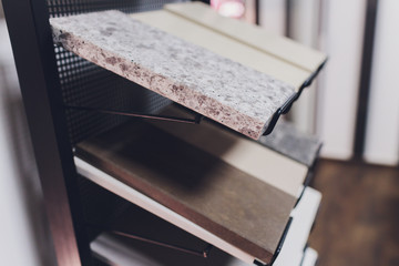 home furnishing store demonstrating variants of stone for kitchen countertop.