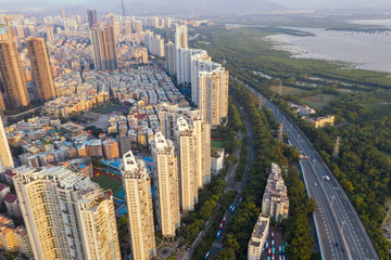 Fototapeta na wymiar an aerial view of a coastal residential community near the highway in shenzhen, china