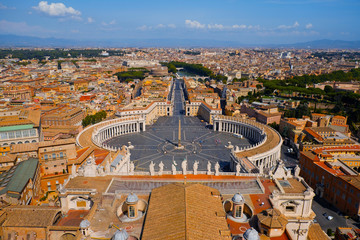 Obraz premium Vatican City view from the top of St. Peter's Basilica in Rome, Italy. Looking down over Piazza San Pietro in Vatican. Saint Peter's Square and aerial view of Roma. Famous travel destination.