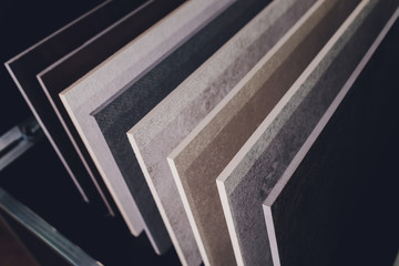 home furnishing store demonstrating variants of stone for kitchen countertop.