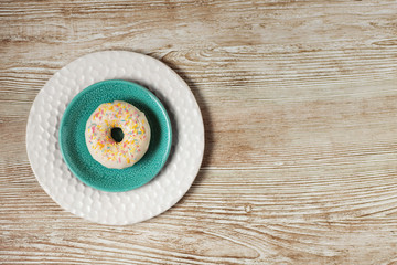 Donut on plate, sweet food background, space for copy