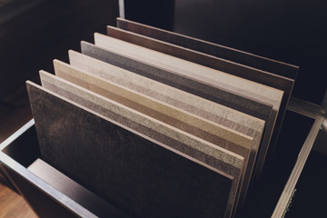 home furnishing store demonstrating variants of stone for kitchen countertop.