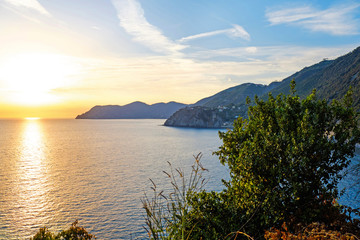 Blue lagoon, island paradise, mountain rocks with green forests. Mediterranean Sea, Italy, popular touristic destination. Europe, Italian coast bay view. Sunset nature background.