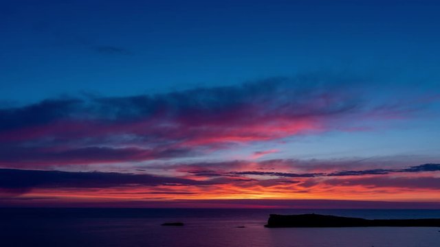 Sunrise sky over sea time lapse