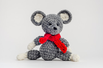 Handmade knitted mouse on a white background