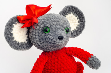 Portrait of a teddy mouse with a red bow on its head