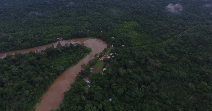 Palacio, Small Settlement/Community in the Amazon Rainforest with Tiny Houses on the Shore of a Large Curved River in Pando / Bolivia