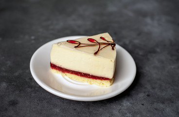 delicious cheesecake on a saucer a stone background