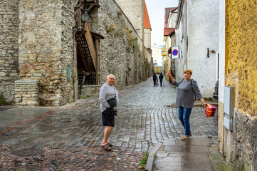 Obraz na płótnie Canvas A Mature married couple walks the streets of the old city.