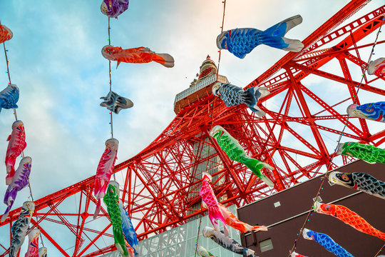 Tokyo, Japan - April 23, 2017: bottom view of colorful Koinobori at Tokyo Tower. Koinobori are carp-shaped wind socks traditionally flown in Japan to celebrate Children's Day during the Golden Week.
